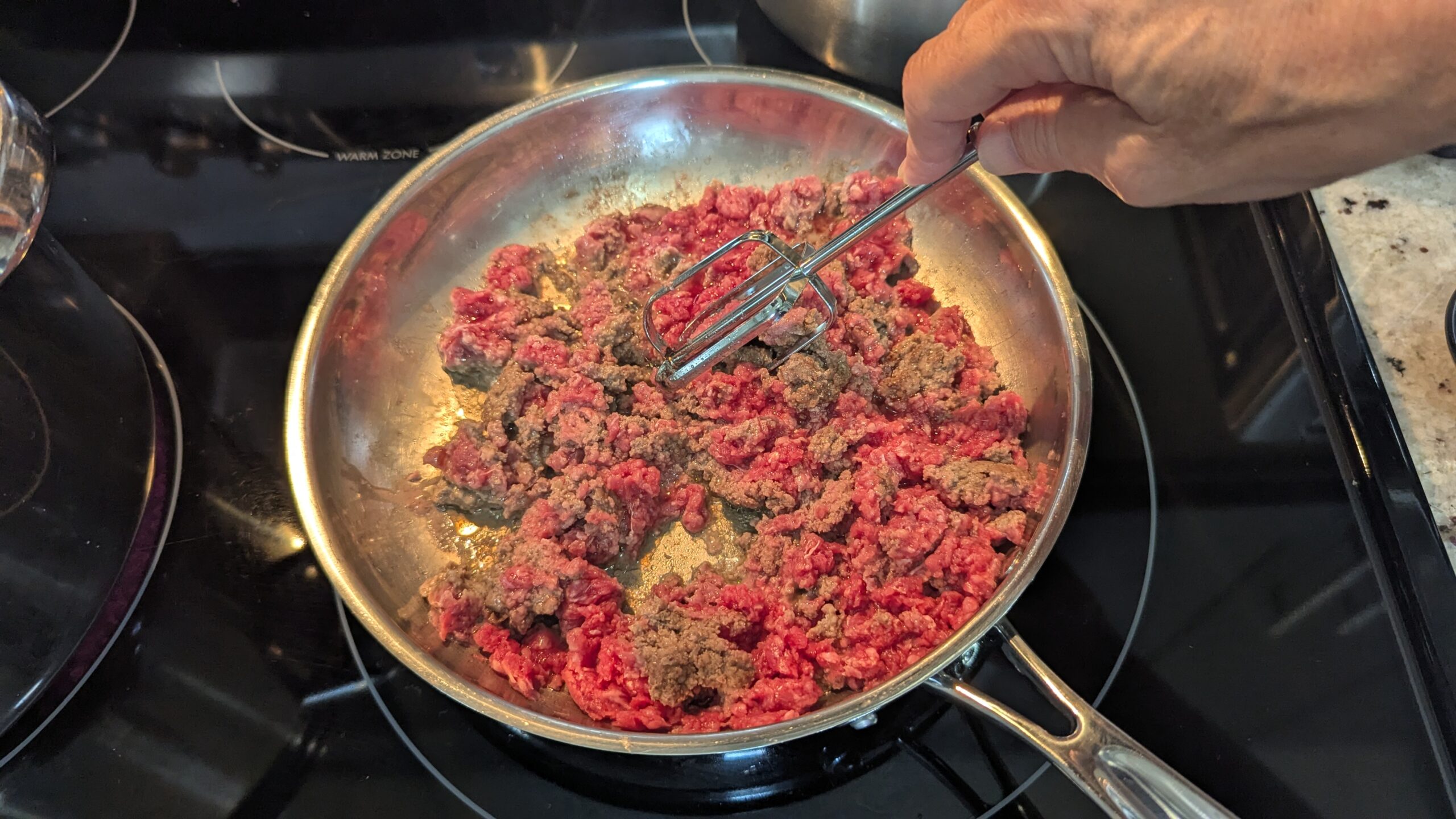 Crumbling ground beef with a beater, by Amy Howard
